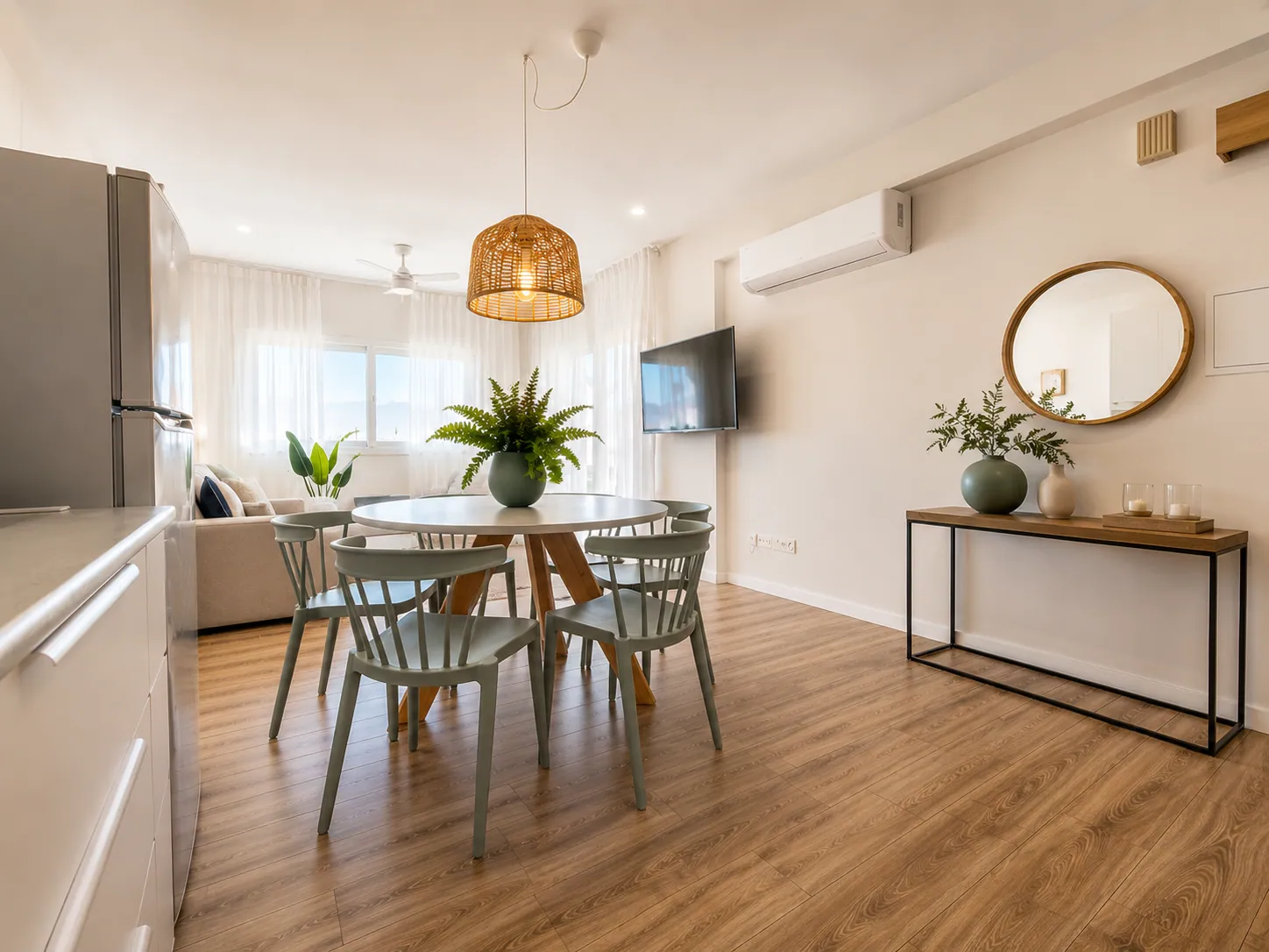 Living and dining area with kitchen at Ember and Tide apartment