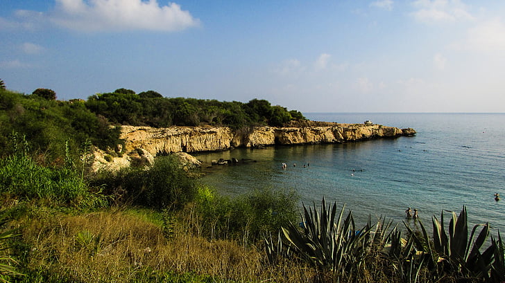 Malama Beach (Skoutarospilioi), a sandy cove with cliffs in Kapparis, Cyprus